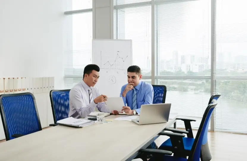 Consultant assisting entrepreneur with documents for business setup and trade license registration in Dubai